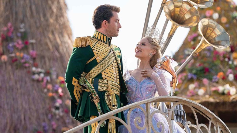 Fiyero and Glinda posing for an adoring crowd in Wicked: For Good