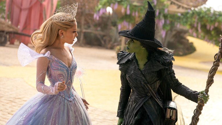 Glinda and Elphaba arguing on the yellow brick road in Wicked: For Good