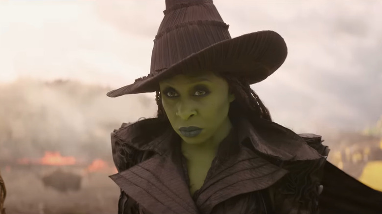 Elphaba looking up intensely (with her hat on) in Wicked: For Good