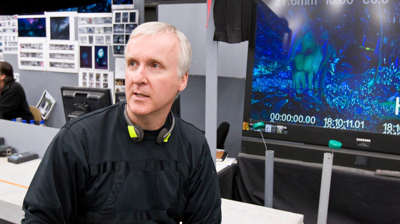 James Cameron sitting by a monitor in a behind-the-scenes still from Avatar
