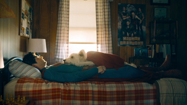 David Cornsoya in the role of Superman sleeps in his bed with Crypo in Superman (2025)