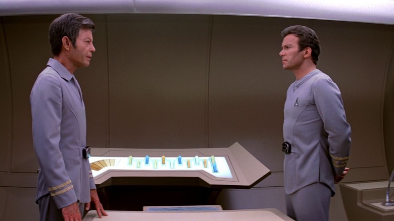 Dr. McCoy and Captain Kirk standing opposite each other in Star Trek: The Motion Picture