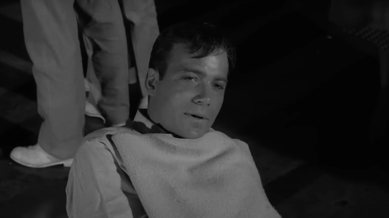 William Shatner's Robert Wilson lays on a stretcher in The Twilight Zone