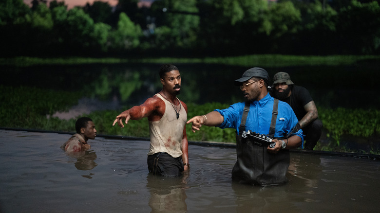 Writer/director Ryan Coogler directing star Michael B. Jordan as Stack on the set of Sinners
