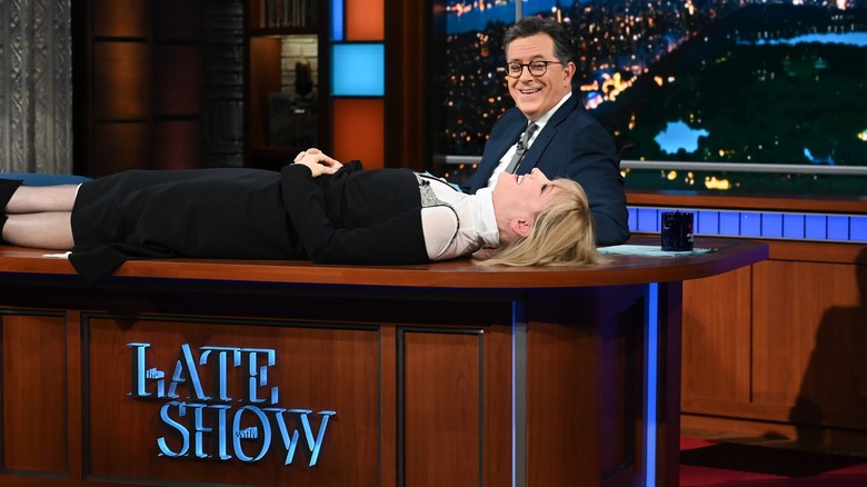 Cate Blanchett laying on Stephen Colbert's desk on The Late Show
