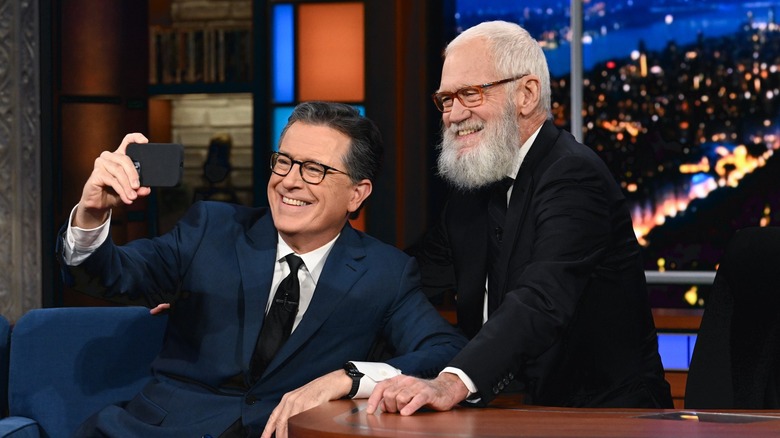 Stephen Colbert taking a selfie with David Letterman on The Late Show