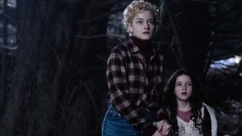 Charlotte, Ginger look nervously into the dark in Wolf Man