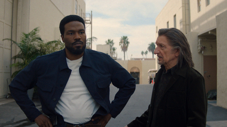 Simon Williams and Trevor Slattery standing next to a car on 