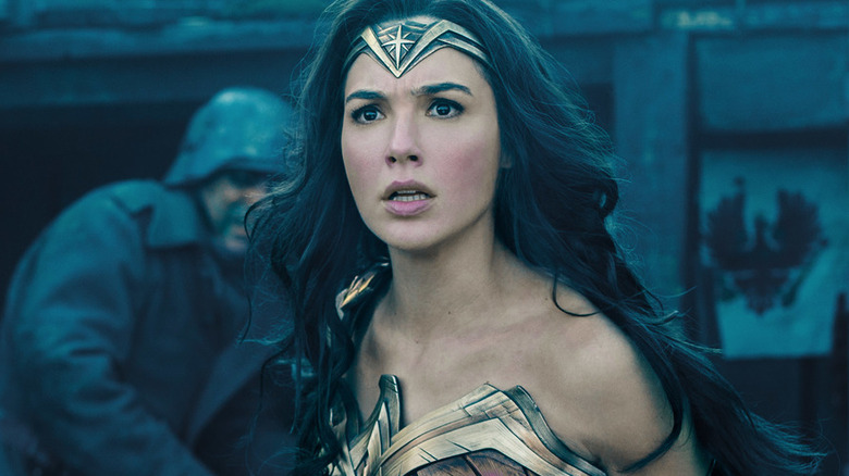 Gal Gadot as Wonder Woman with a look of shock on her face in the trenches in Wonder Woman