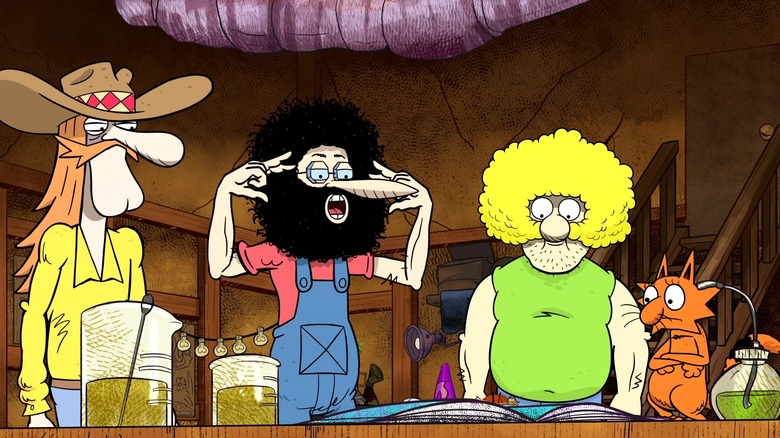 Freewheelin' Frankie Freak, Phineas T. Phreakers, Fat Freddie Freekowtski, and Kitty looking at a book in The Freak Brothers