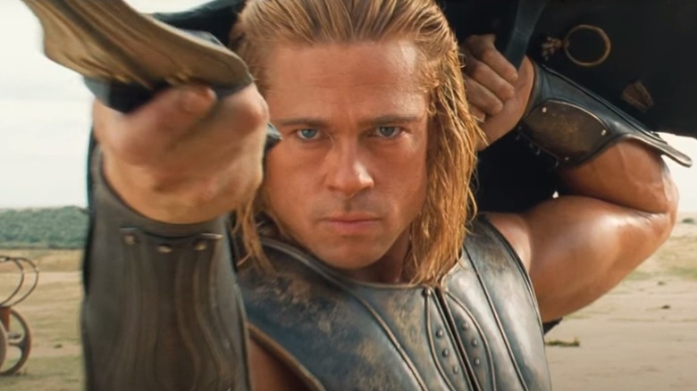 Brad Pitt proves they had hair product in ancient Greece, looking prim under a shield in Troy