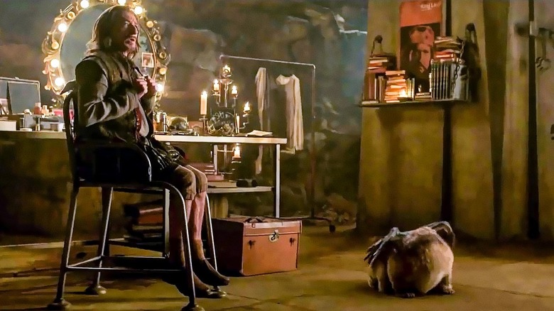 Ben Kingsley as Trevor Slattery with Morris in Shang-Chi and the Legend of the Ten Rings