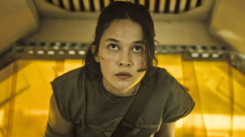 Cailee Spaeny as Rain Carradine standing in a brightly-lit room in Alien: Romulus