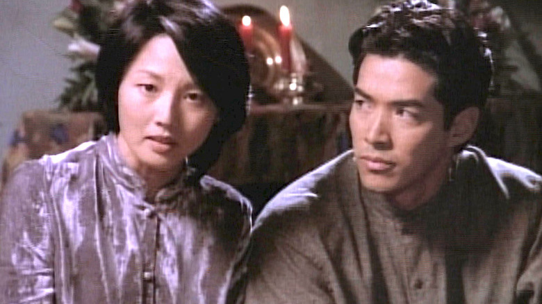 A woman and Jian-Wa in a dining room in the TV series Vanishing Son