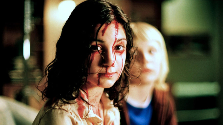 Lina Leandersson and Kåre Hedebrant in Let the Right One In