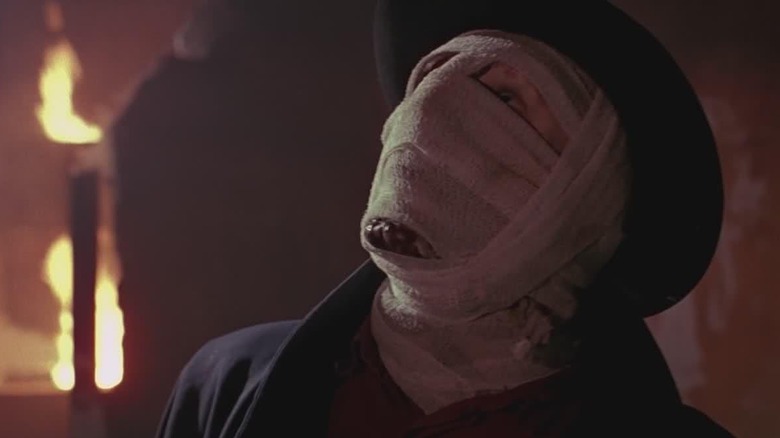 Liam Neesone as Darkman looking up in Darkman