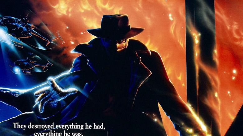 Dr. Peyton Westlake as Darkman surrounded by flames in front of the city on the poster for Darkman