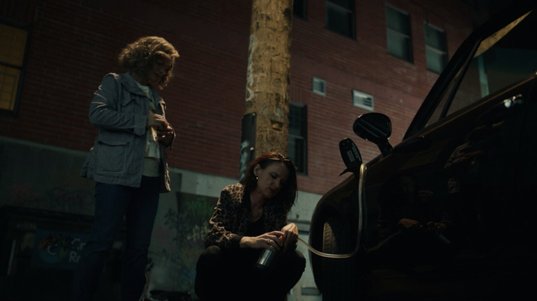 Misty and Natalie siphoning gas in Yellowjackets