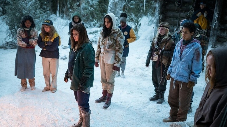 Yellowjackets season 2 episode 2 survivors looking at fire outside cabin
