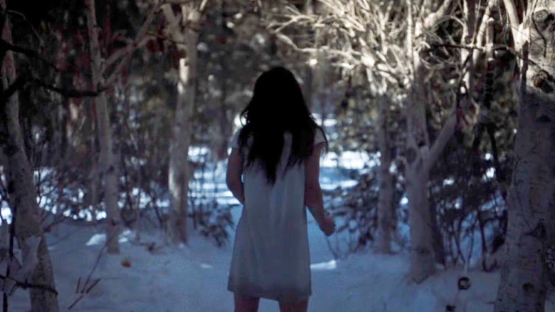 Pit Girl running for her life in a frozen forest on Yellowjackets