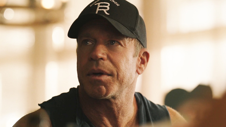 Taylor Sheridan's Travis Wheatley looks up as he sits at a poker game in Yellowstone