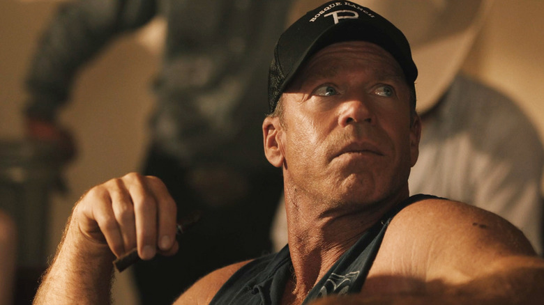 Taylor Sheridan's Travis Wheatley turns to look over his shoulder in Yellowstone