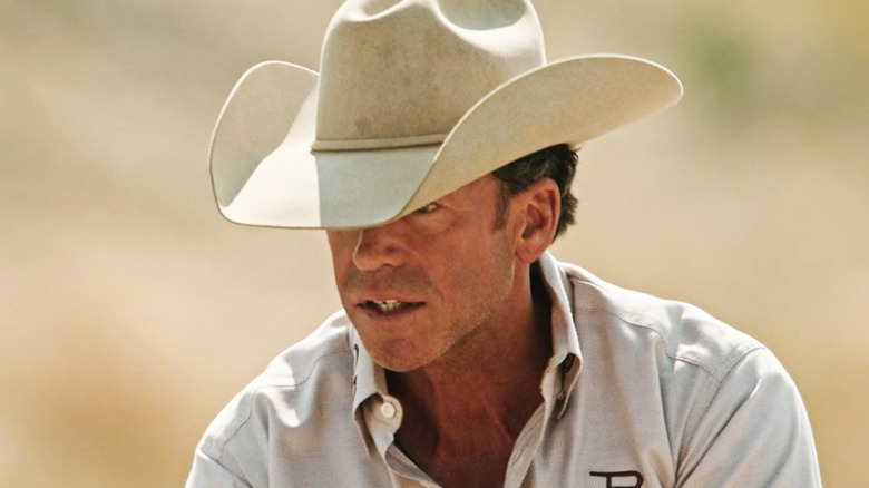 Taylor Sheridan's Travis Wheatley is seen with his stetson over his eyes in Yellowstone