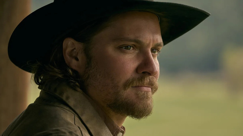 Luke Grimes as Kayce, staring into the distance on Yellowstone