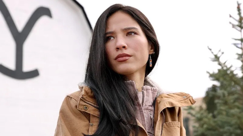 Kelsey Asbille as Monica in front of the ranch house on Yellowstone