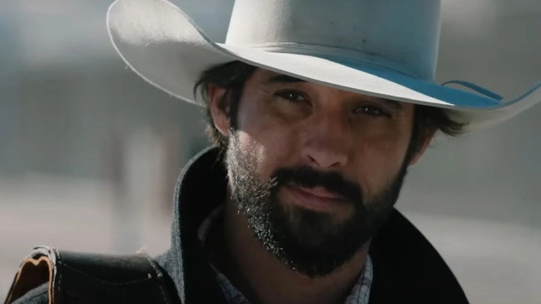 Ryan Bingham as Walker, smiling on Yellowstone