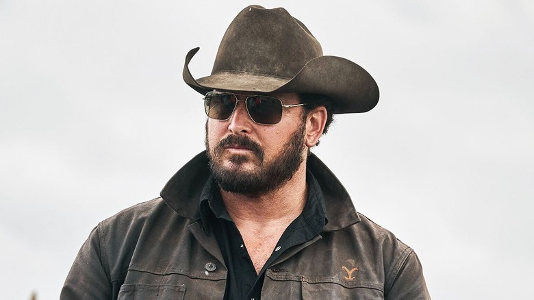 Cole Hauser as Rip Wheeler standing out doors on Yellowstone