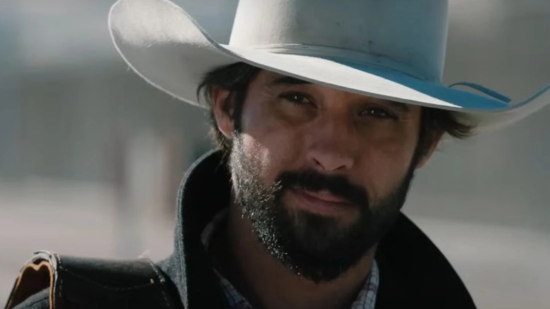 Ryan Bingham as Walker, smiling on Yellowstone