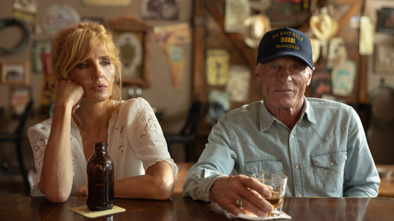 Kelly Reilly's Beth Dutton sits next to Ed Harris' Everett McKinney at a bar in Dutton Ranch