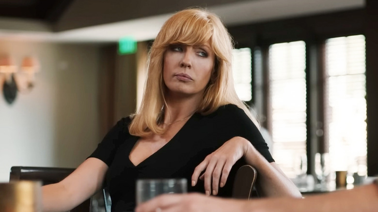 Kelly Reilly's Beth Dutton sits at a bar in Yellowstone