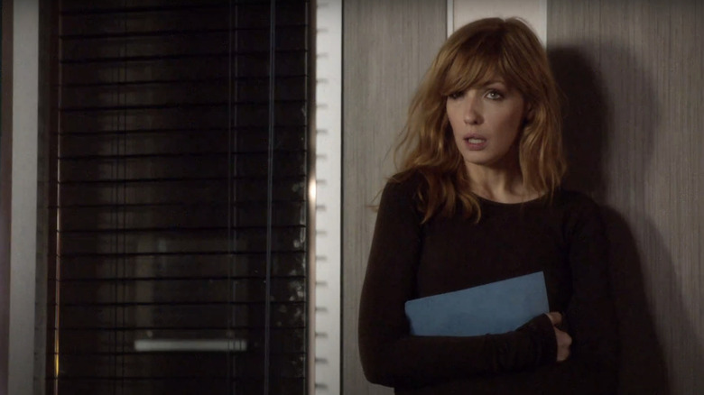 Kelly Reilly's Catherine Black stands against a wall looking surprised in Black Box