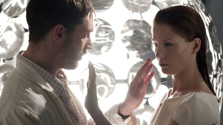 Fleming and Andromeda reach out to each other in A for Andromeda