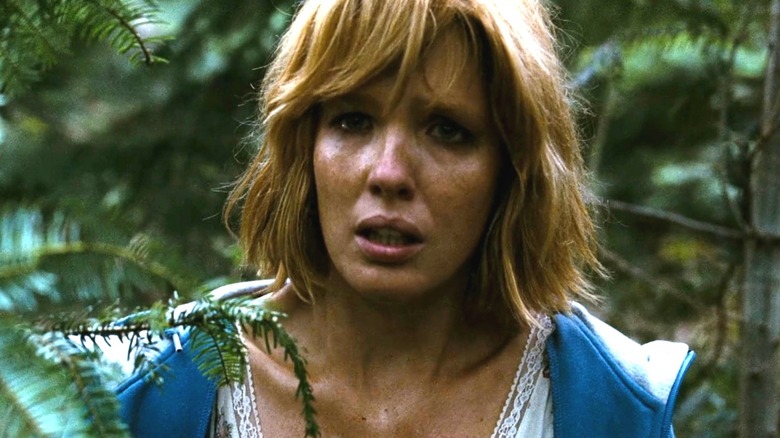 Jenny looking scared in the bushes in Eden Lake