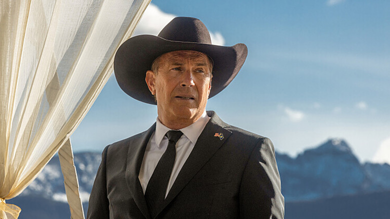 Kevin Costner's John Dutton is seen in closeup against a mountainous backdrop in Yellowstone