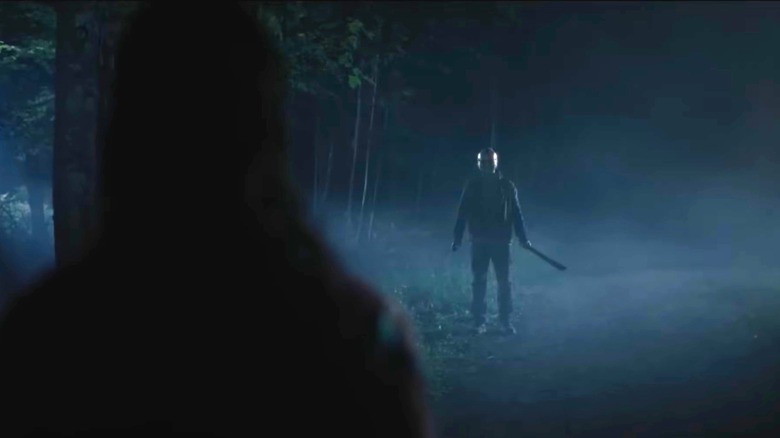 Jason standing off in the distance as Eve watches in Sweet Revenge