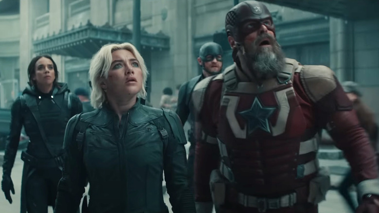 Ghost, John Walker, Red Guardian, and Yelena Belova standing in the street, looking up in Thunderbolts