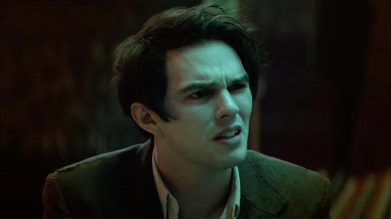 Nicholas Hoult as Renfield looking bewildered 