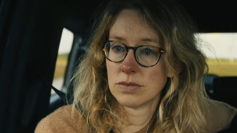 Elizabeth Holmes wears glasses in a car in You Can See Everything