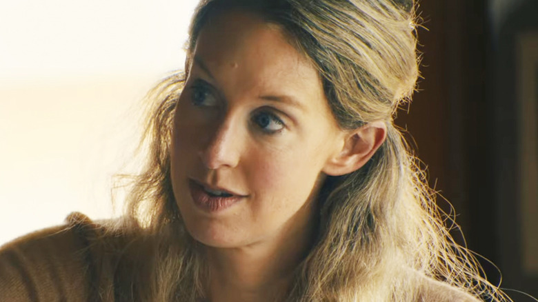 Elizabeth Holmes is seen in closeup looking off to her right in You Can See Everything
