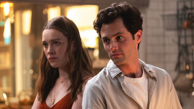 Love Quinn and Joe Goldberg stand next to each other in You