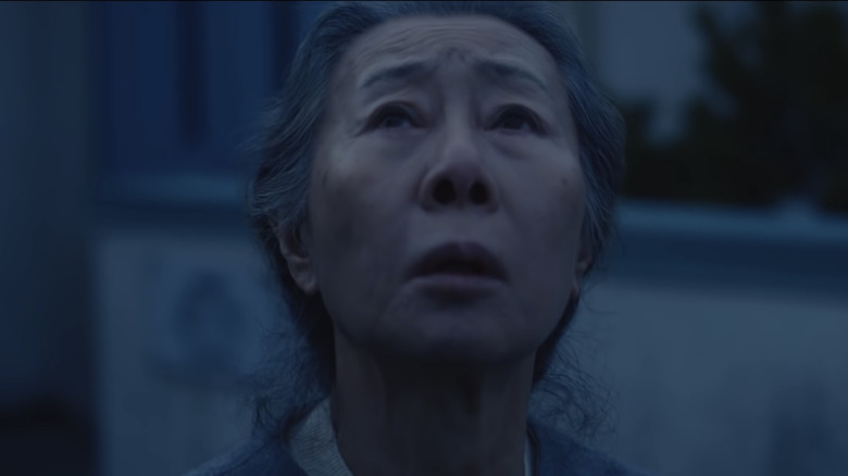 Youn Yuh-Jung in Pachinko looking up