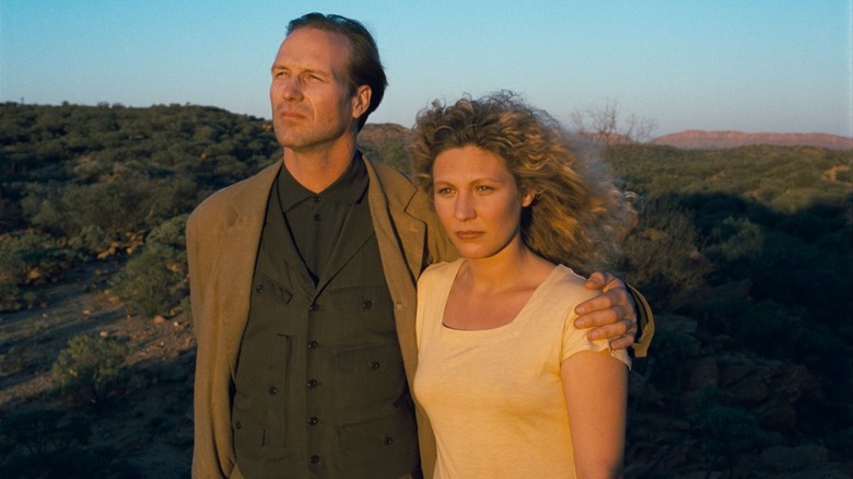 Sam Farber aka Trevor McPhee watches a sunset with Solveig Dommartin as Claire Tourneur in Until the End of the World