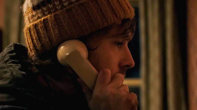 Austin Abrams as Bryan using a phone in Resident Evil (2026)