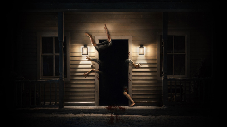 A spooky house with mutant limbs coming out of it in Resident Evil (2026)