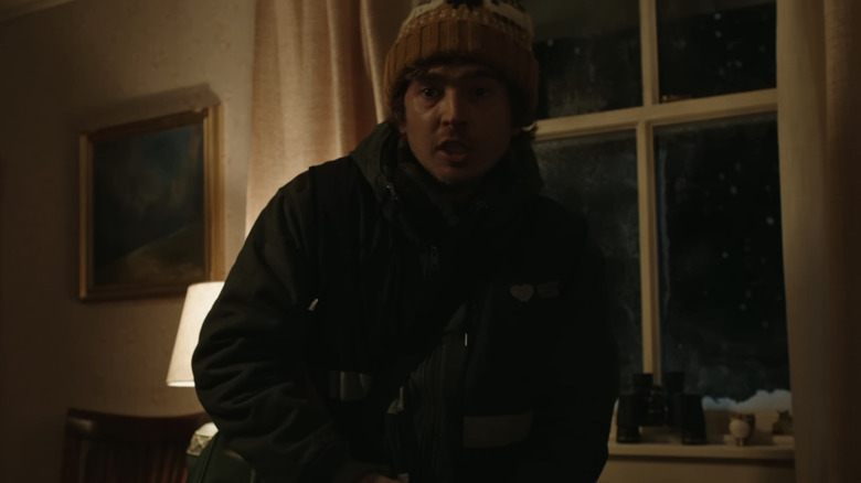 Bryan looks alarmed in Resident Evil