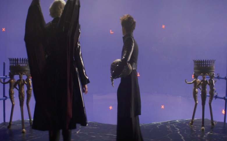 Gwendoline Christie as Lucifer and Tom Sturridge Actor as Dream standing on the balcony of Lucifer's palace